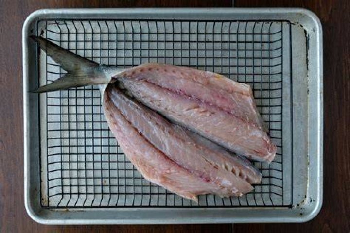 How do you wrap Bluefish filets in bacon?