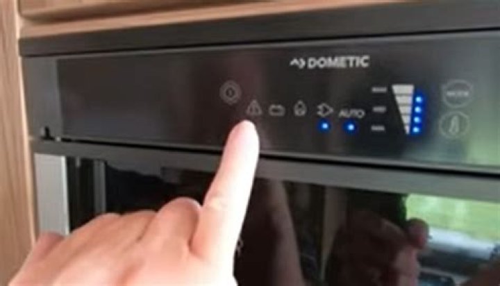 Where is the reset button on a Dometic Refrigerator?